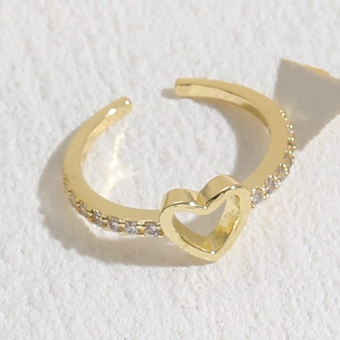 Glamouröser offener Ring in Herzform mit Kupfereinlage und Zirkon, 14 Karat vergoldet