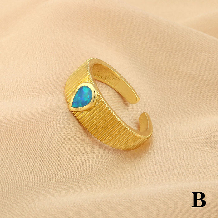 Schlichter Stil, ovale Wassertropfen, Kupferbeschichtung, Inlay, künstliche Edelsteine, 18 Karat vergoldete offene Ringe