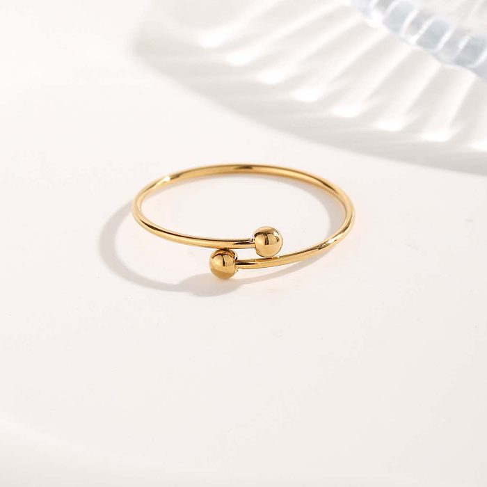 Atacado glam estilo simples redondo titânio aço chapeado anéis banhados a ouro