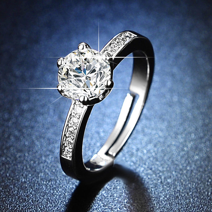 Offener Ring mit glänzendem, geometrischem Kupfer-Inlay und Strasssteinen