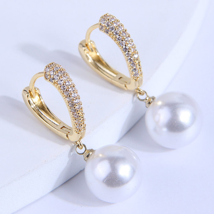 1 paire de clous d'oreilles en perles de cuivre avec incrustation géométrique élégante