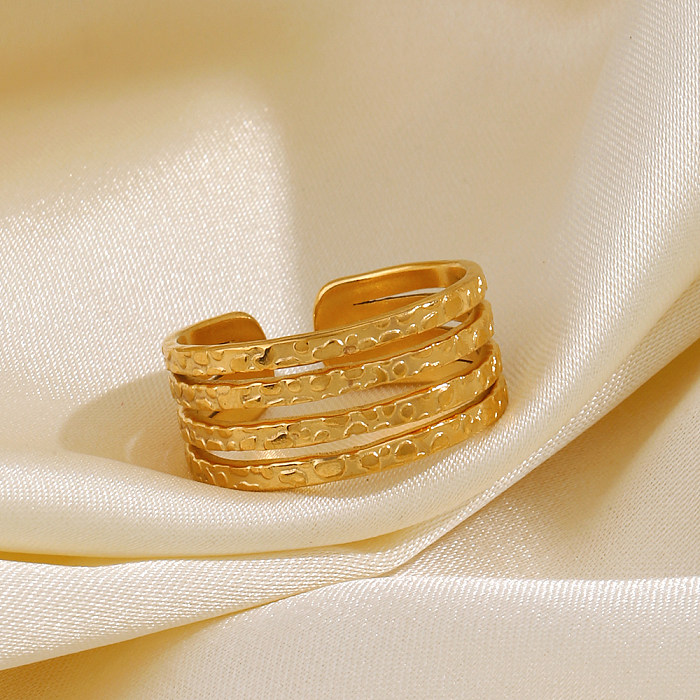 O estilo simples básico alinha anéis abertos banhados a ouro de aço inoxidável do chapeamento 18K