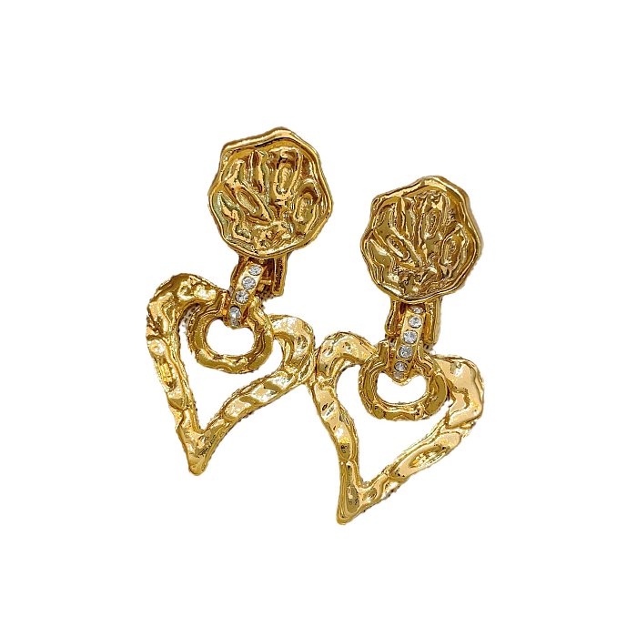 1 paire de boucles d'oreilles pendantes en cuivre plaqué en forme de cœur