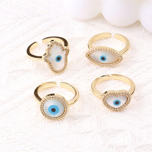 Anillo de concha creativo de cobre con circonita de ojo del diablo a la moda europea y americana, joyería al por mayor