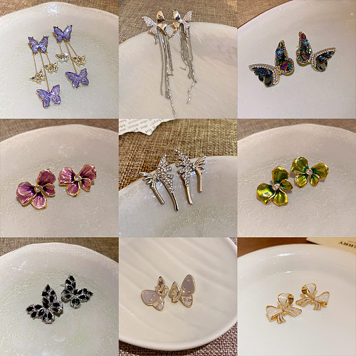 Mode Schmetterling Schleife Knoten Kupfer eingelegte Zirkon künstliche Perlen Ohrringe 1 Paar