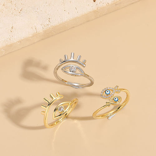 Elegante anillo abierto chapado en oro de 14 quilates con incrustaciones asimétricas de cobre y ojo del diablo