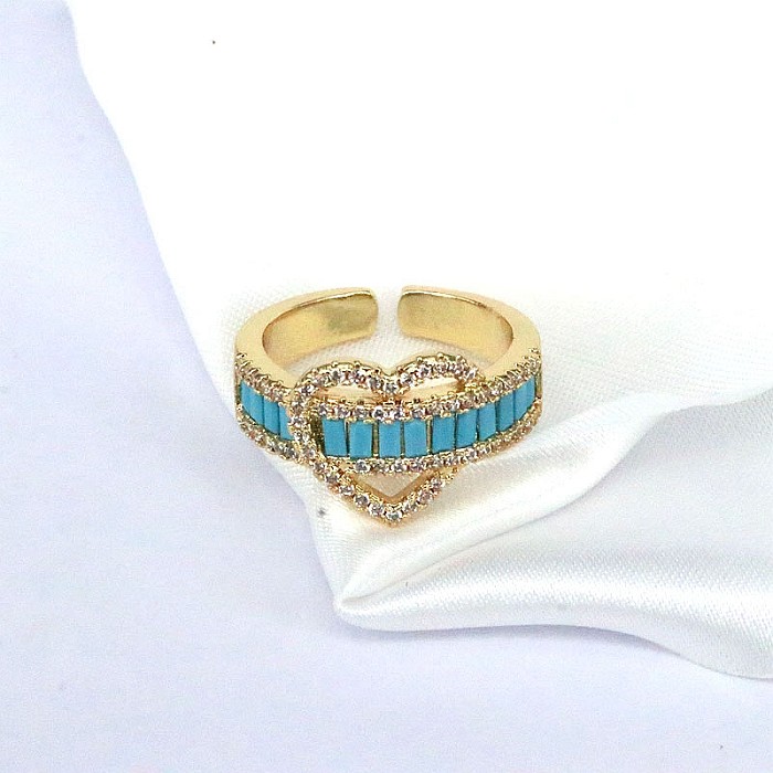 INS-Stil, eleganter, modischer, herzförmiger, verkupferter, offener Ring mit Inlay aus Zirkon und vergoldetem Zirkon