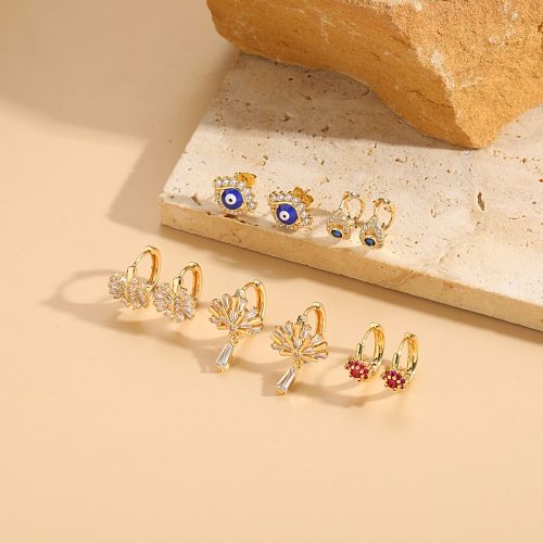 1 Paar elegante Teufelsaugen-Ohrringe mit Inlay-Kupfer-Zirkon-Vergoldung und 14-Karat-Vergoldung
