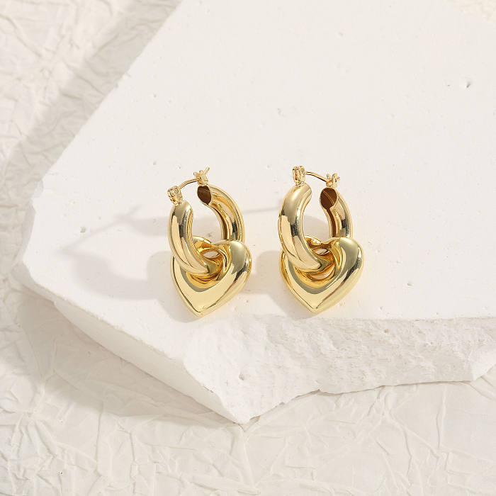1 par de pendientes colgantes chapados en oro de 14 quilates con forma de corazón, elegantes y lujosos, de estilo clásico