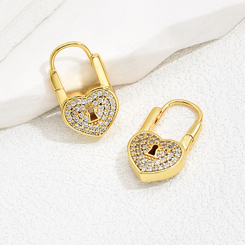 1 Paar Urlaubs-Ohrringe in Herzform mit Schlosseinlage, Kupfer-Zirkon, 18 Karat vergoldet