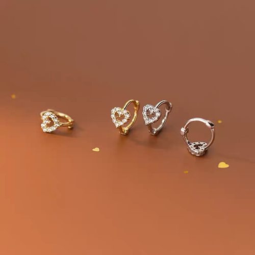 1 paire de clous d'oreilles en Zircon incrustés de cuivre en forme de cœur de Style Simple
