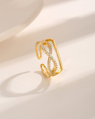 Estilo moderno estilo simples infinito chapeamento de cobre embutimento zircão 18K anéis abertos banhados a ouro