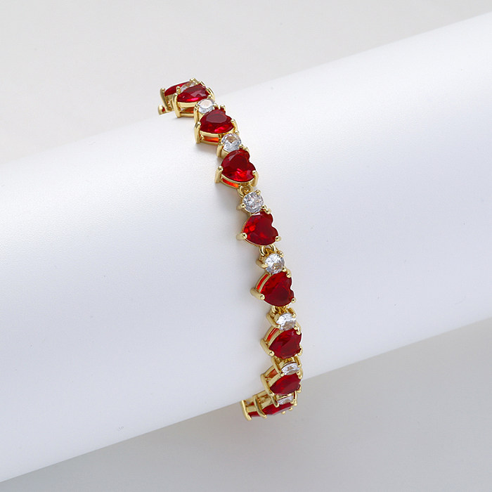 Elegante, glänzende, herzförmige Verkupferungs-Inlay-Zirkon-18-Karat-vergoldete Damen-Armband-Halskette