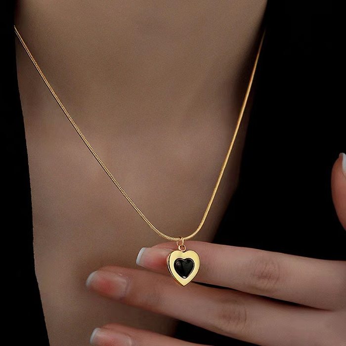 Elegante formato de coração titânio chapeamento de aço incrustação obsidiana colar de brincos banhado a ouro 18K
