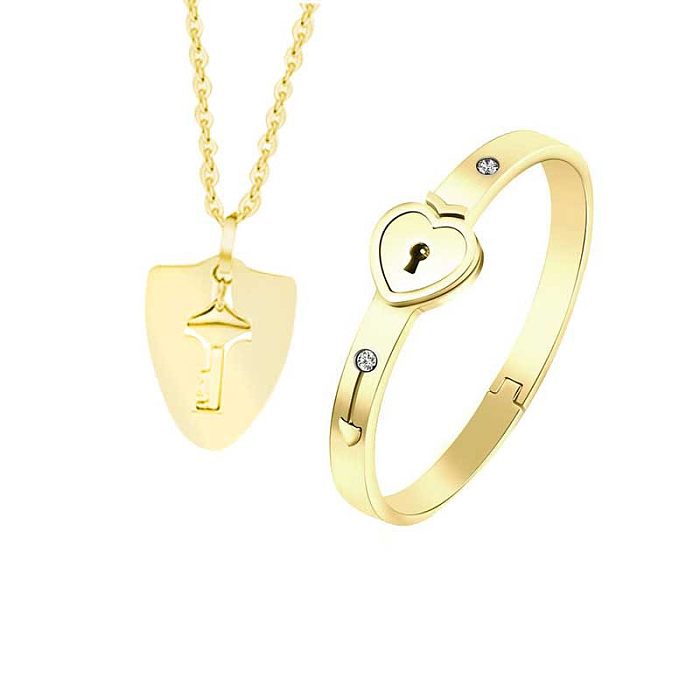 Collar de pulseras de diamantes de imitación con incrustaciones de acero titanio con llave en forma de corazón de estilo moderno IG