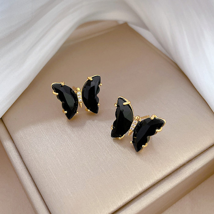 1 paire de clous d'oreilles en cuivre avec incrustation de nœud solaire pour dame, pierres précieuses artificielles