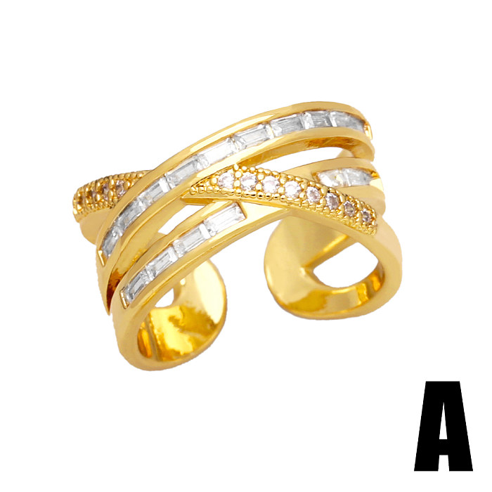 O deslocamento ocasional redondo do chapeamento de cobre embutiu anéis abertos banhados a ouro do zircão 18K