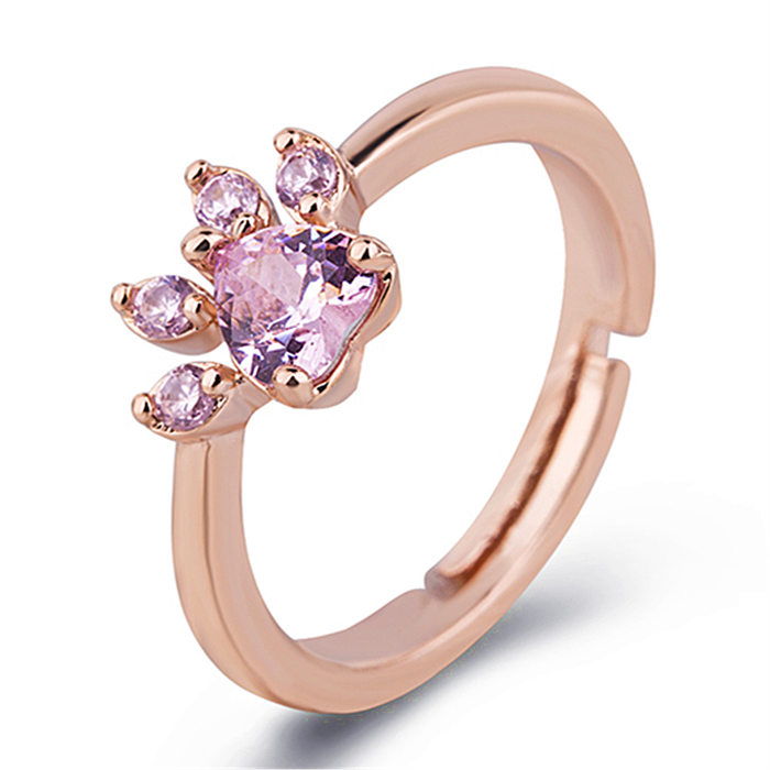 Collar con pendientes y anillos chapados en oro rosa con incrustaciones de cobre con estampado de pata dulce