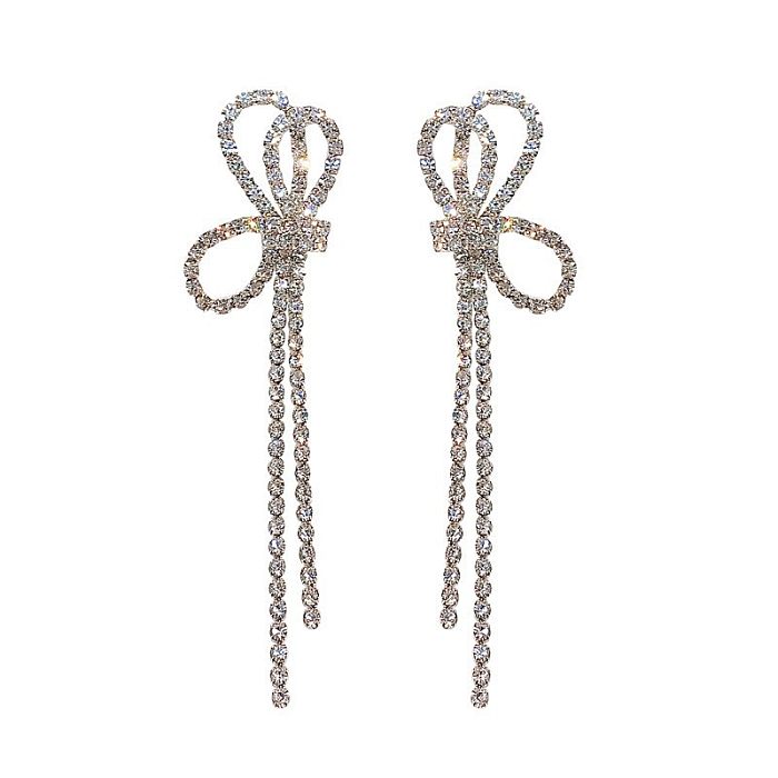 Boucles d'oreilles pendantes élégantes avec nœud papillon en cuivre et diamants, 1 paire