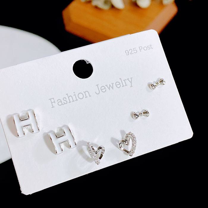 Simple Style Geometric Heart Shape Bow Knot Copper Plating Inlay Artificial Gemstones Ear Studs