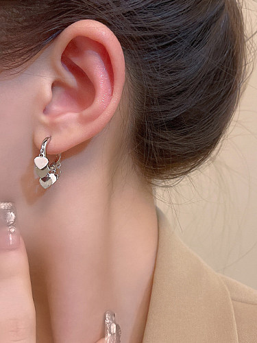 1 paire de boucles d'oreilles pendantes en cuivre, couleur unie, en forme de cœur, pompon