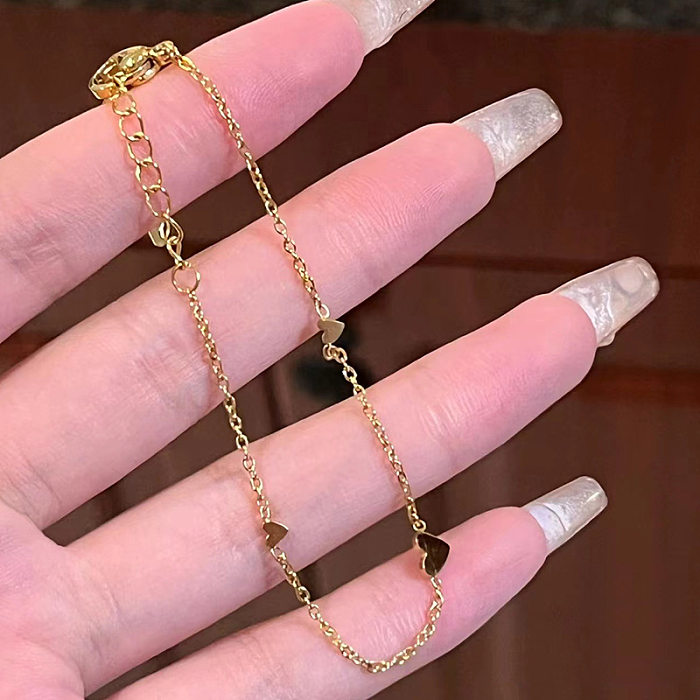 Collier de bracelets de placage en acier titane en forme de coeur de style simple