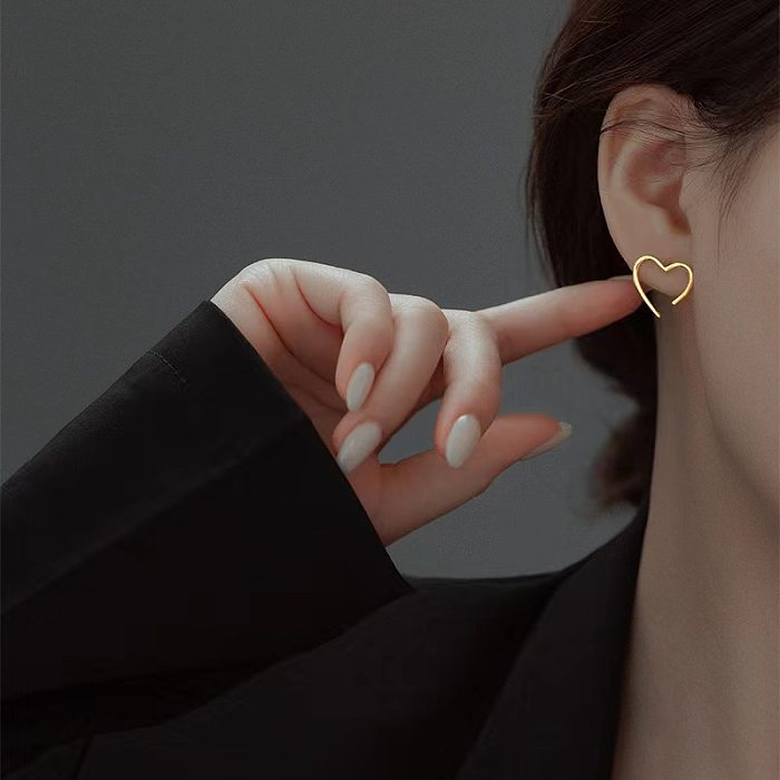 Collier de boucles d'oreilles plaqué or 18 carats en acier titane en forme de cœur de style simple