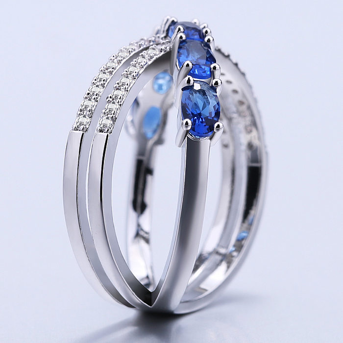 Elegantes anillos de circón con incrustaciones de cobre cruzado brillante