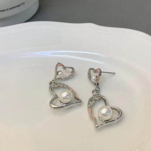 1 par de brincos revestidos de cobre em formato de coração estilo simples