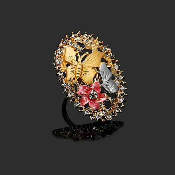 Elegante flor de acero inoxidable con incrustaciones de cobre y circonita chapada en oro de 18 quilates