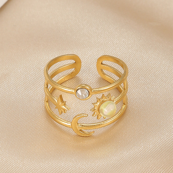 Elegante, glänzende, offene Ringe mit Stern- und Mond-Titan-Stahl-Beschichtung und Türkis-Gold-Beschichtung