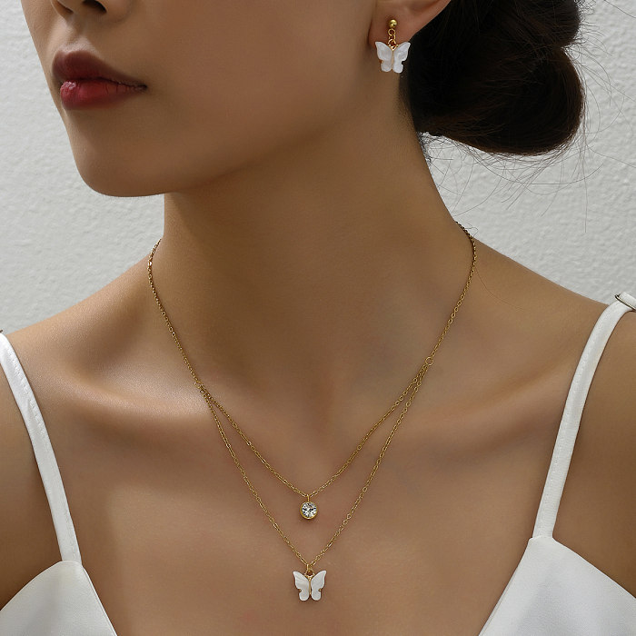 Élégant doux style classique croix coeur forme papillon en acier inoxydable plastique cuivre placage 18K plaqué or boucles d'oreilles collier
