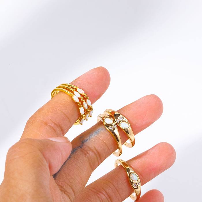 Einfache ovale Ringe mit Kupferbeschichtung und Inlay aus Opal-Zirkon