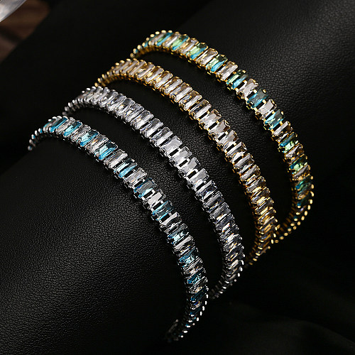 O estilo simples comuta braceletes chapeados ouro do zircão do cobre 18K da cor sólida no volume