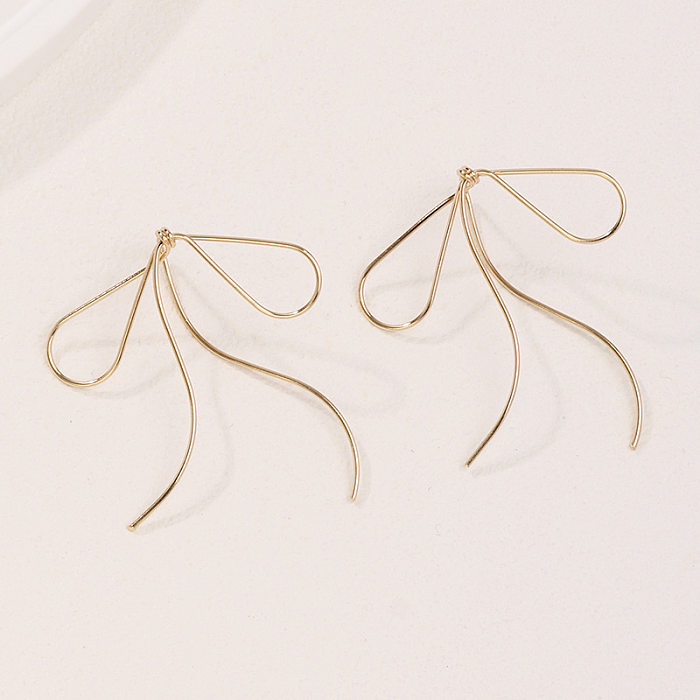 1 paire de boucles d'oreilles pendantes en cuivre plaqué or, Style Simple, nœud papillon