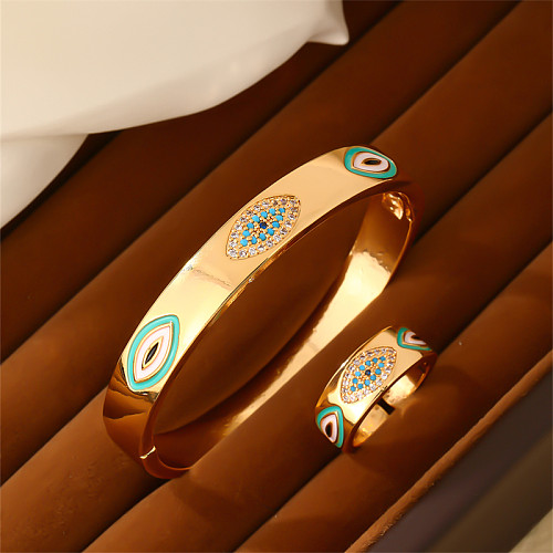 Pulseras de anillos chapados en oro con incrustaciones de esmalte de cobre y ojo de diablo redondo elegante informal