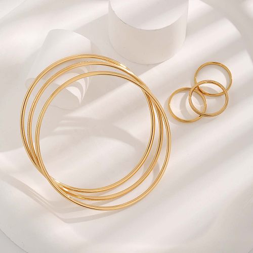 Pulseiras de anéis banhados a ouro com chapeamento de aço de titânio redondo estilo simples e luxuoso