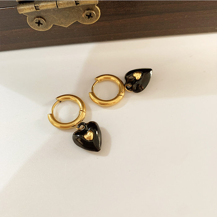 Collier de boucles d'oreilles en acier titane en forme de coeur de style moderne