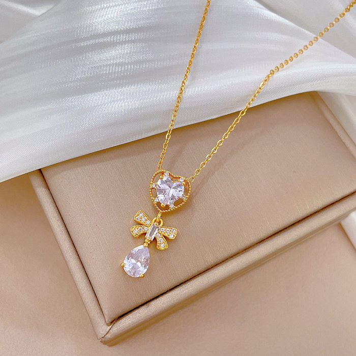 Modern Style Commute Heart Shape Bow Knot Titanium Steel Copper Plating Inlay Artificial Gemstones Gold Plated Pendant Necklace