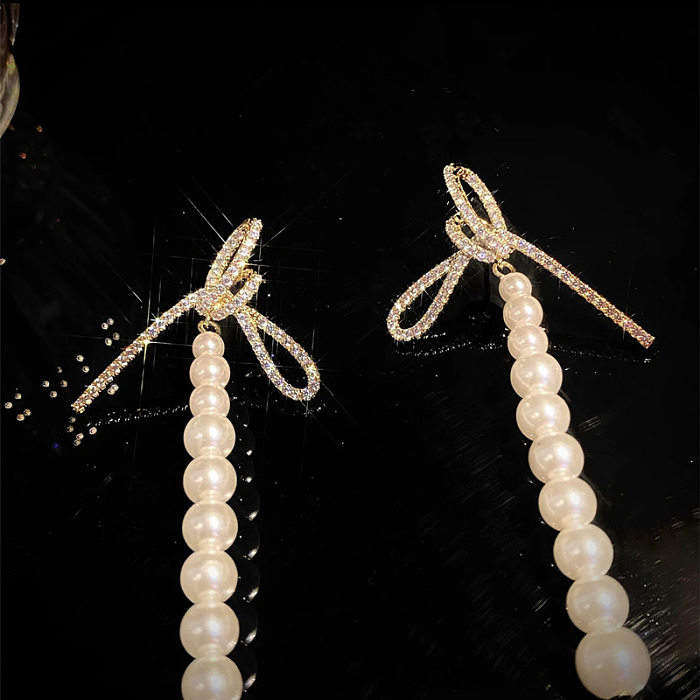 1 Paar Lady Pearl Bow Knot Unregelmäßige Perlen Inlay Kupfer Zirkon Tropfenohrringe
