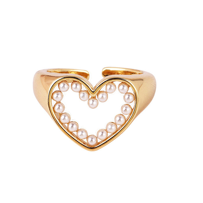 Glamouröser offener Ring mit geometrischen Kupfer-Kunstperlen und Zirkonen in großen Mengen