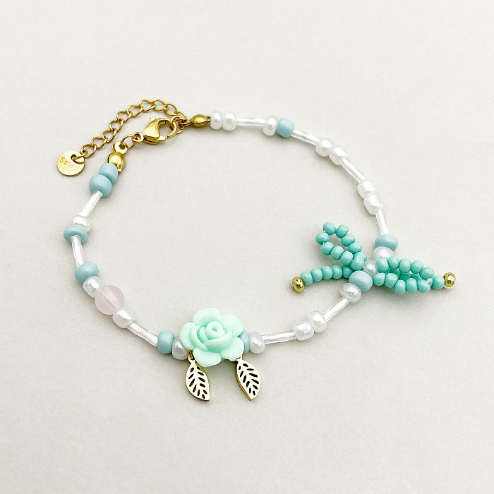Collier de bracelets plaqués or ajouré avec nœud papillon et fleur en forme de feuille douce, placage de perles en acier inoxydable