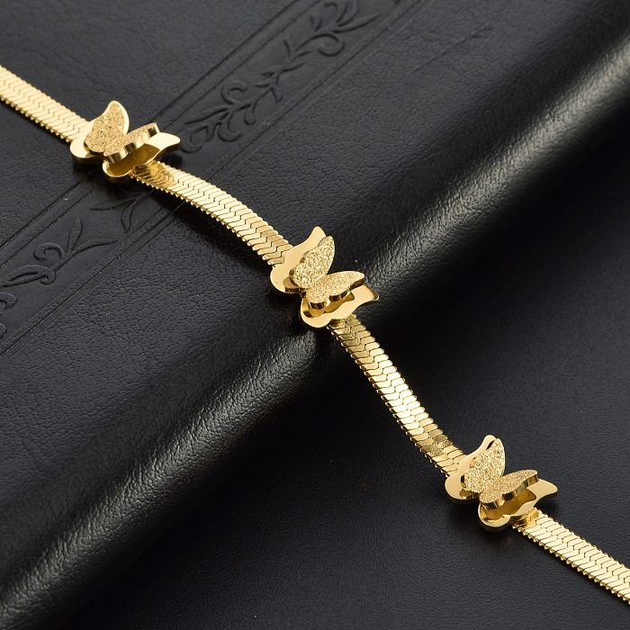 Conjunto de joyería chapado en oro de 18 quilates de acero titanio y mariposa dulce elegante