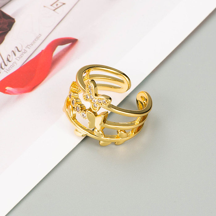 Verkupferter, geometrischer Schmetterlingsring aus 18 Karat Gold mit verstellbarer Zeigefingeröffnung