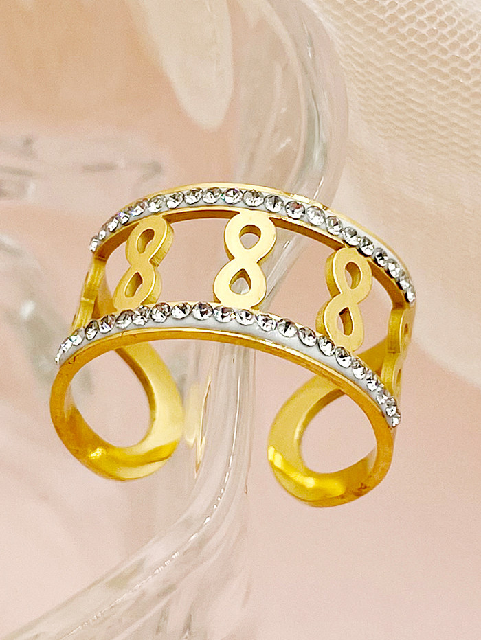 Eleganter, schlichter, offener Infinity-Ring aus Edelstahl mit vergoldeten Strasssteinen in großen Mengen