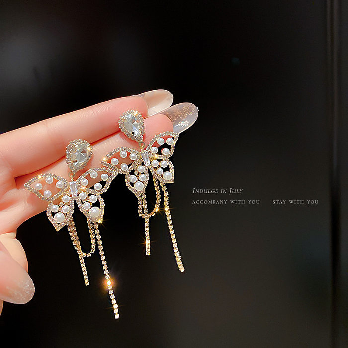 Pendientes colgantes de circonita con incrustaciones de cobre y perlas artificiales, nudo de lazo de mariposa y flor a la moda, 1 par
