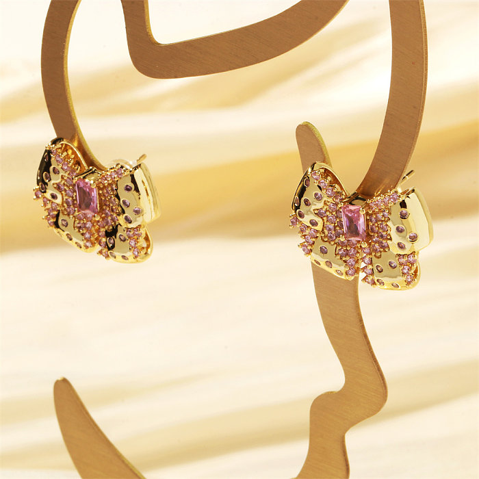 1 paire de boucles d'oreilles plaquées or 18 carats avec nœud papillon brillant et incrusté de cuivre et de zircon