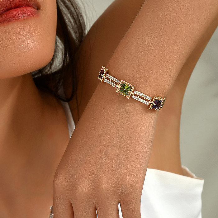 Glamouröse, luxuriöse, glänzende, geometrische Blatt-Kupfer-Schnalle-Überzug-Inlay-Zirkon-Armbänder mit 18-Karat-Vergoldung