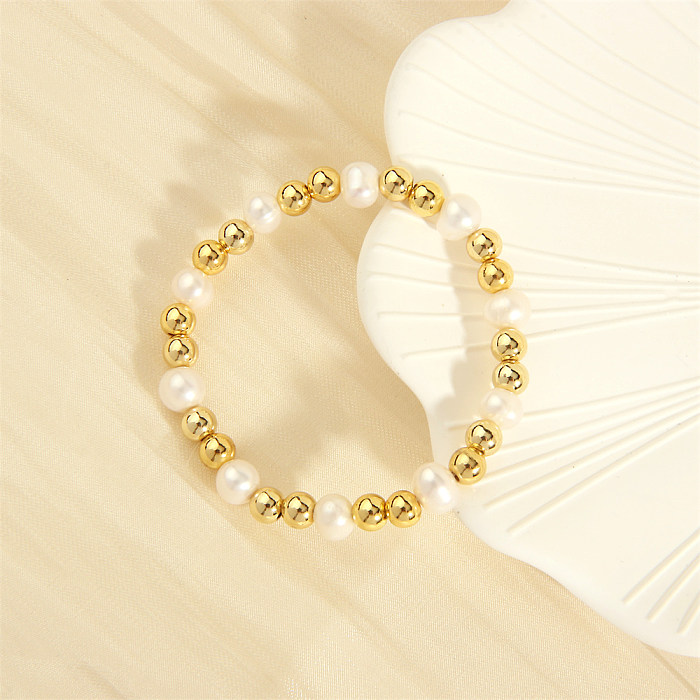 Pulseras chapadas en oro de 18 quilates con revestimiento de cobre y perlas de agua dulce redondas irregulares de estilo simple retro