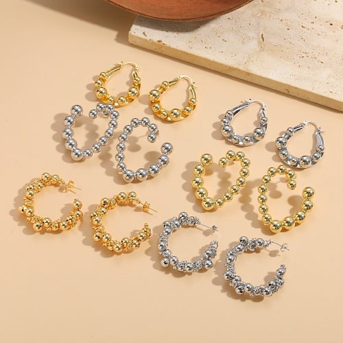 1 Paar schlichte, runde, einfarbige, asymmetrische Kupfer-Ohrringe mit 14-Karat-Vergoldung